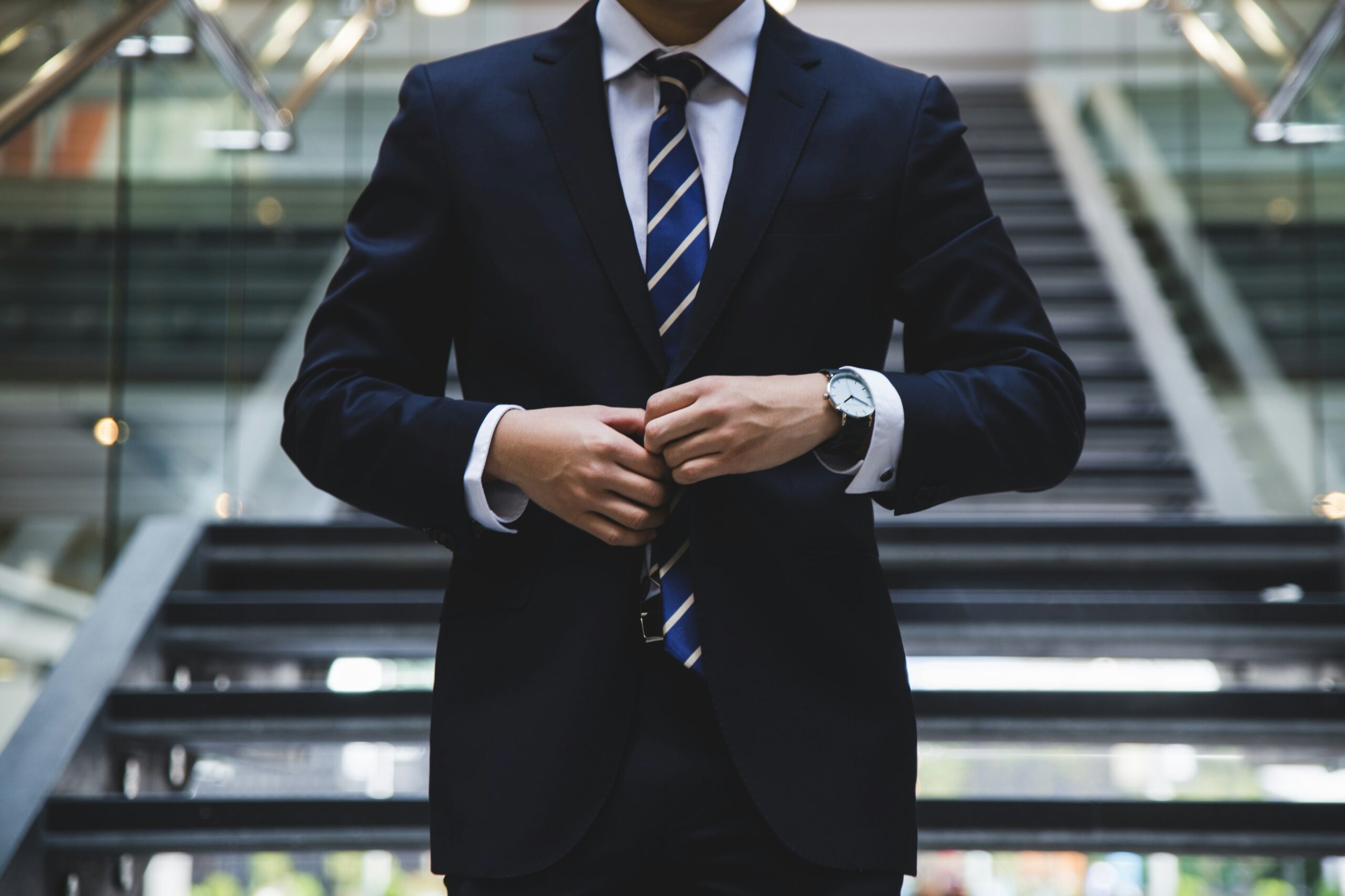 Man adjusting suit, preparing for interview
